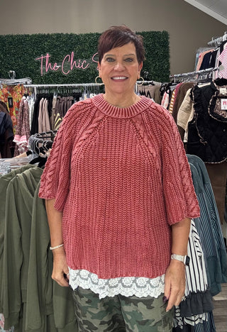 Rose/rust short sleeve sweater withRose/rust short sleeve sweater with lace trim on the bottom on model in store