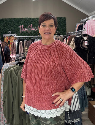 Rose/rust short sleeve sweater withRose/rust short sleeve sweater with lace trim on the bottom on model in store
