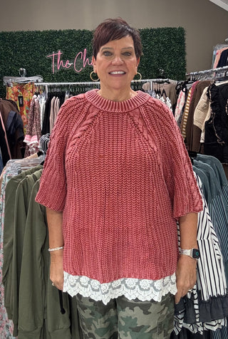 rose/rust short sleeve sweater with lace on bottom on model in store